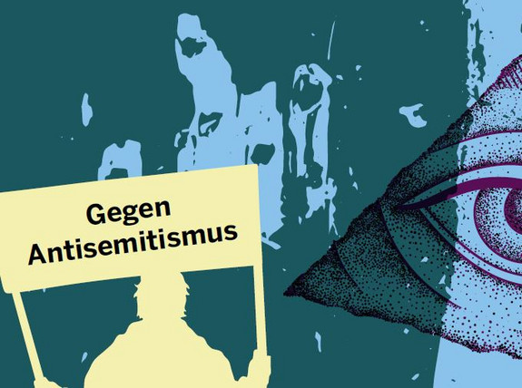 Das Bild zeigt die Aufschrift "Gegen Antisemitismus" auf einem Schild gehalten eines Menschen.